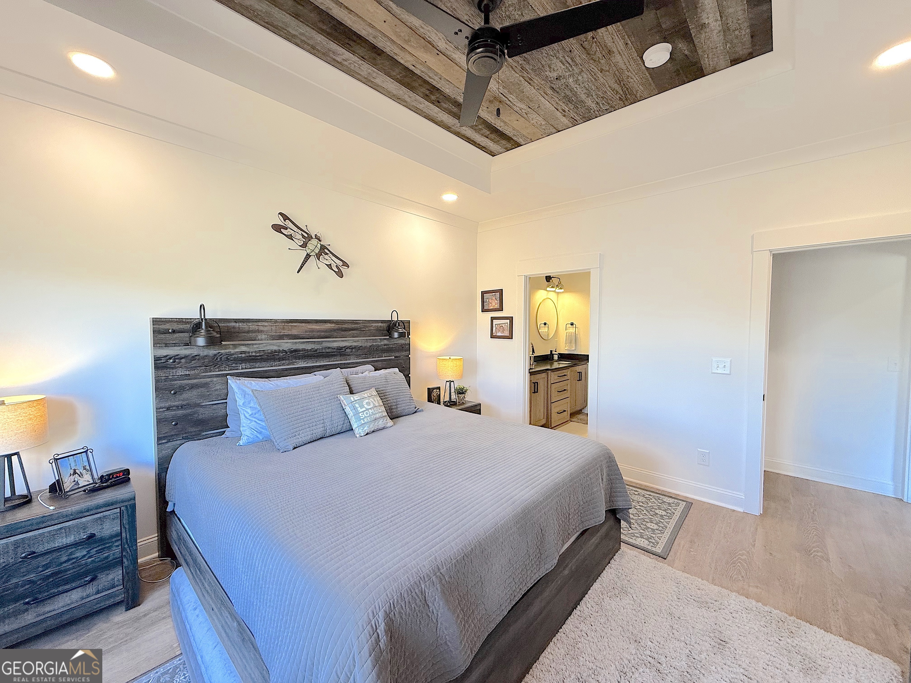 73 Yacht Club Hartwell, GA 30643 - Photo 31 of 71 a bedroom with a bed and wooden floor