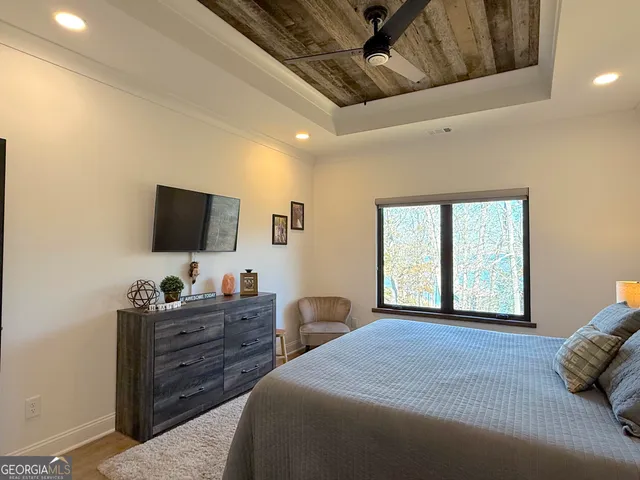 a bedroom with bed and a window