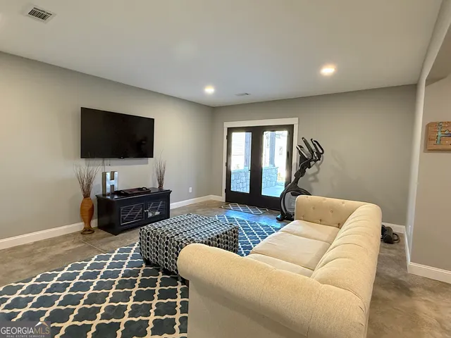 a view of a house with a yard covered in snow