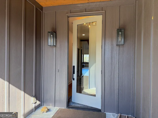 a view of a balcony with wooden floor