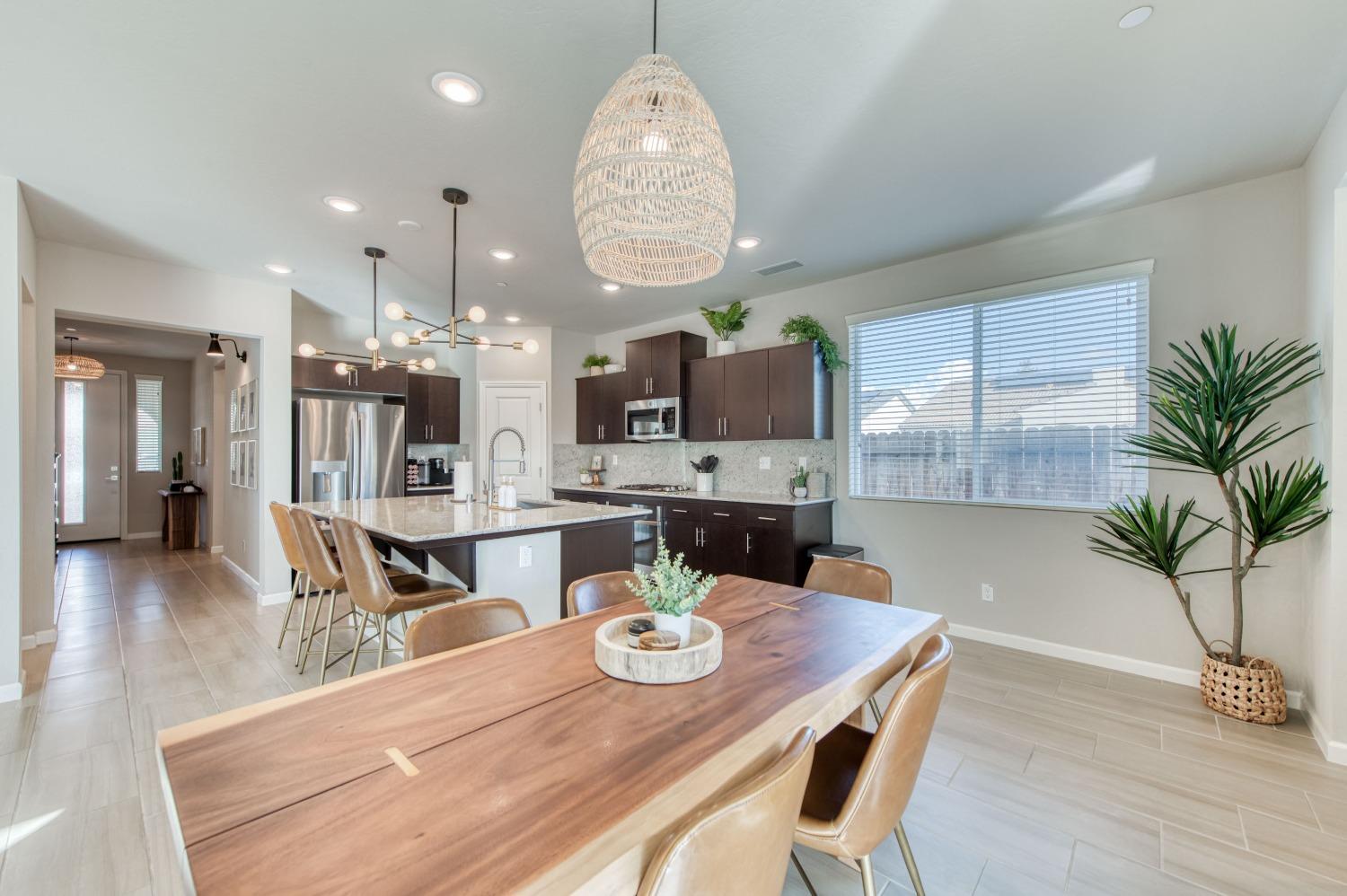 4136 Mecca Avenue Clovis, CA 93619 - Photo 2 of 44 a view of a dining room with furniture window and wooden floor