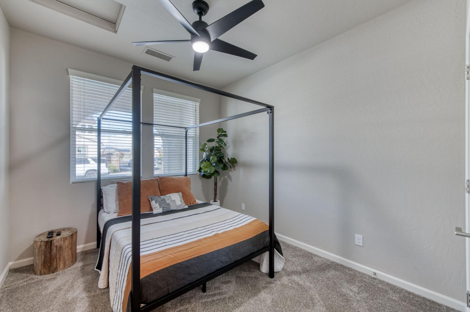 4136 Mecca Avenue Clovis, CA 93619 - Photo 24 of 44 a bedroom with furniture and a window