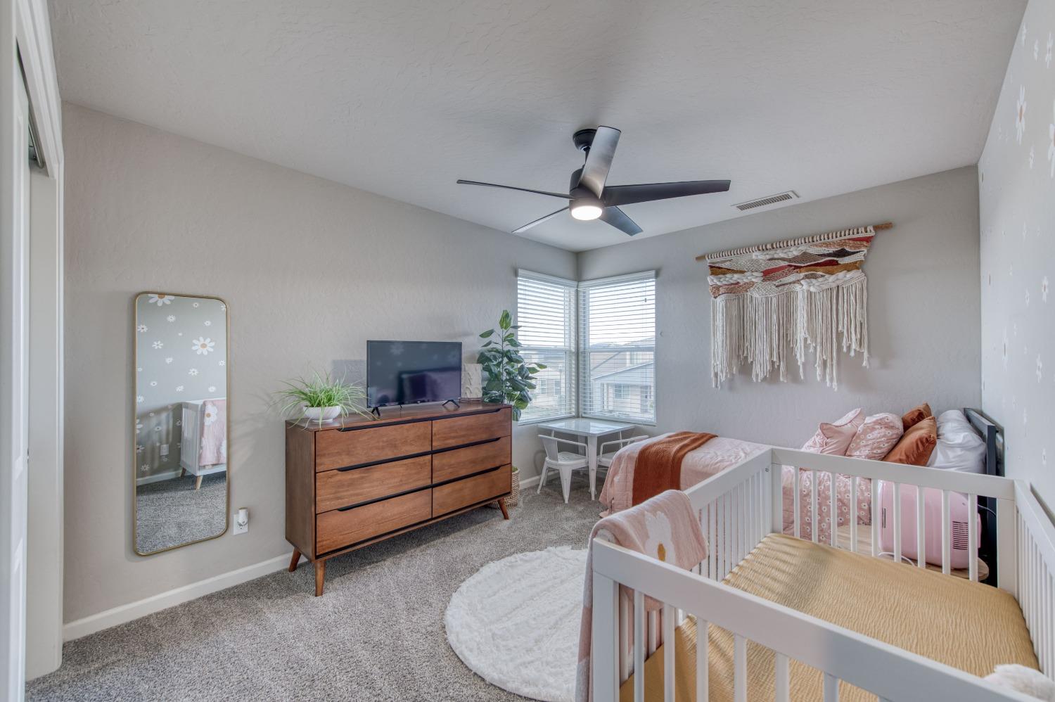 4136 Mecca Avenue Clovis, CA 93619 - Photo 36 of 44 a bedroom with furniture and a bed