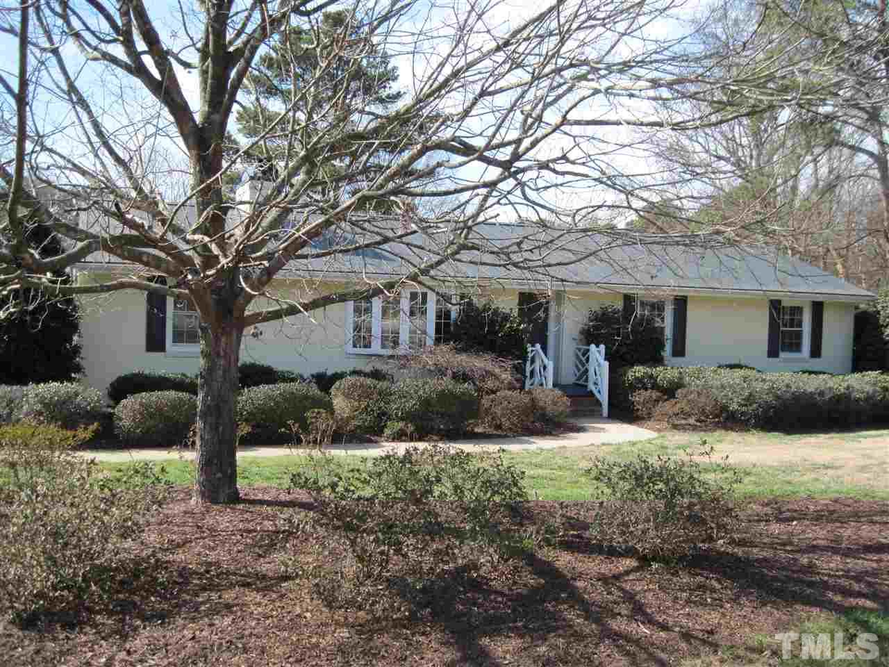 4105 St James Church Road Raleigh, NC 27604 - Photo 1 of 24 a front view of a house with a yard and porch