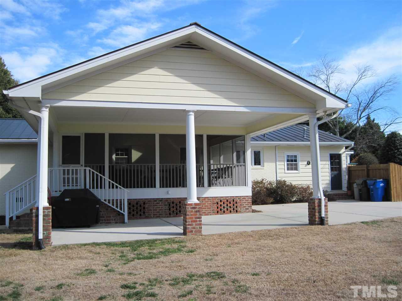 4105 St James Church Road Raleigh, NC 27604 - Photo 2 of 24 a front view of a house with a yard
