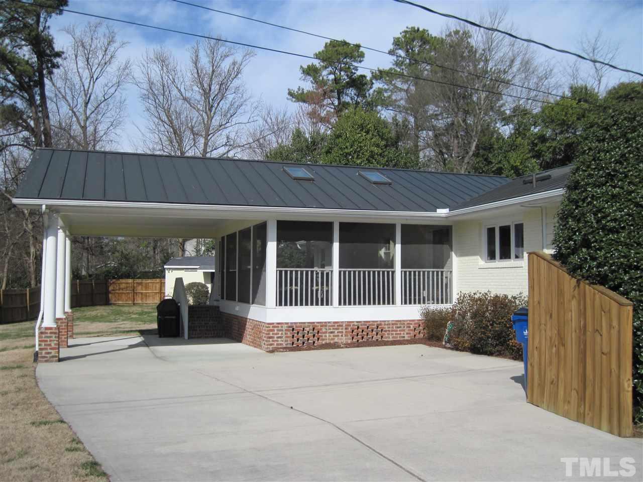 4105 St James Church Road Raleigh, NC 27604 - Photo 19 of 24 a front view of a house with a garden and pathway