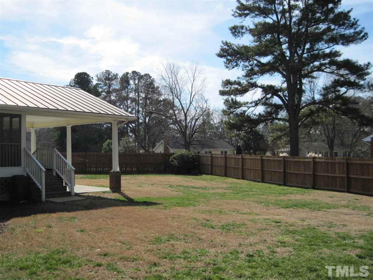 4105 St James Church Road Raleigh, NC 27604 - Photo 21 of 24 a view of a backyard with a trampoline