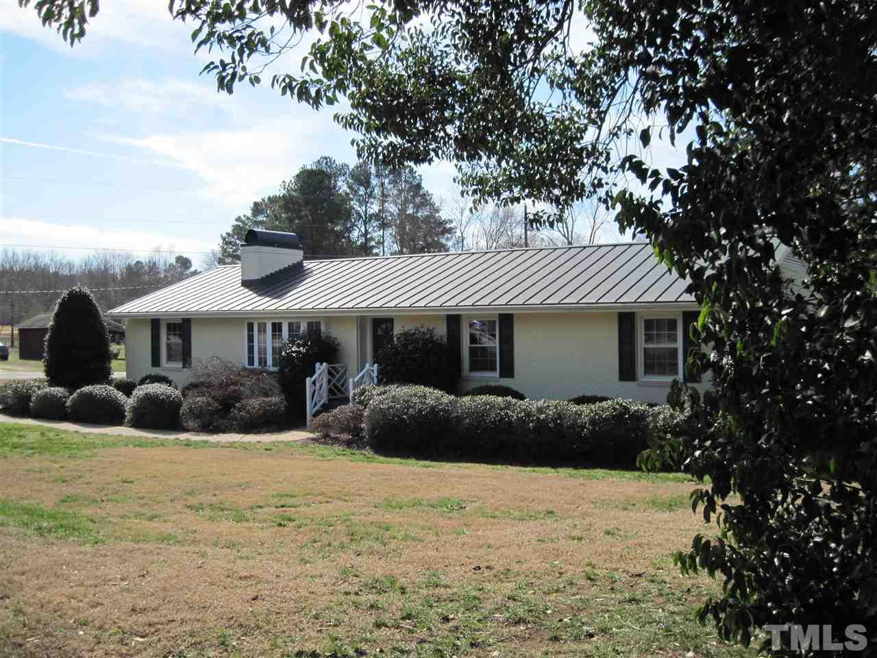 4105 St James Church Road Raleigh, NC 27604 - Photo 23 of 24 a front view of a house with a yard