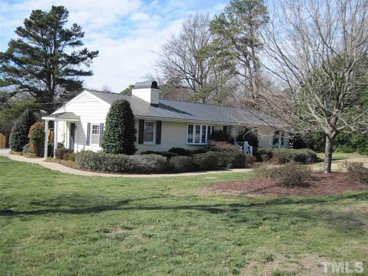 4105 St James Church Road Raleigh, NC 27604 - Photo 24 of 24 a front view of a house with a yard