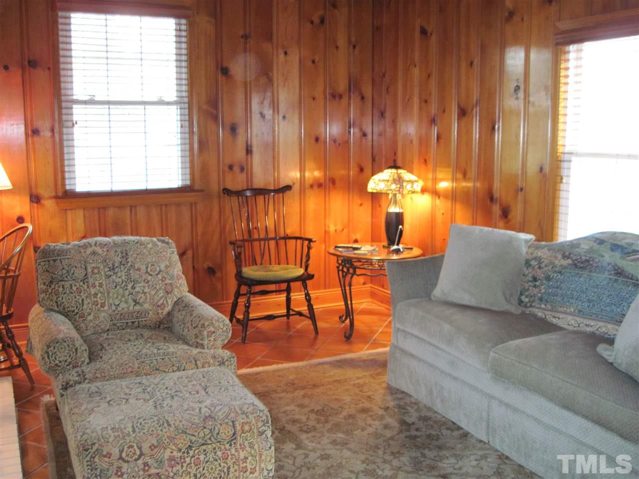 4105 St James Church Road Raleigh, NC 27604 - Photo 4 of 24 a living room with furniture and a large window