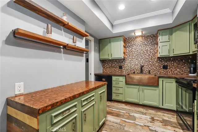 a kitchen with a sink and a stove top oven