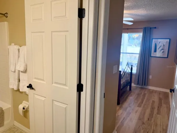 a view of a bathroom from a hallway
