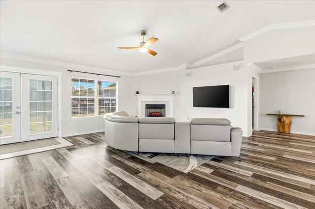 a living room with furniture and a flat screen tv