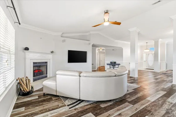 a living room with furniture and a fireplace