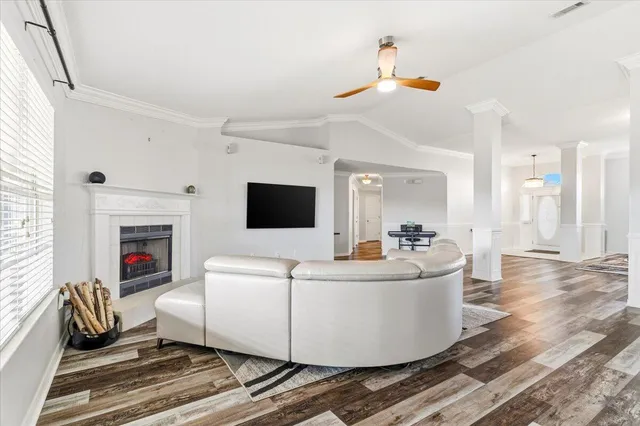 a living room with furniture and a fireplace