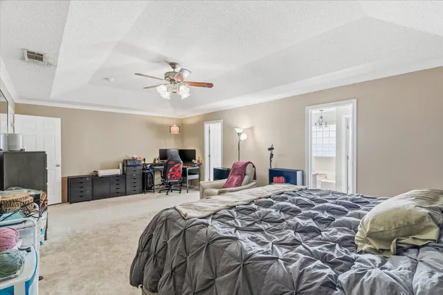 a bed room with a bed and a tv