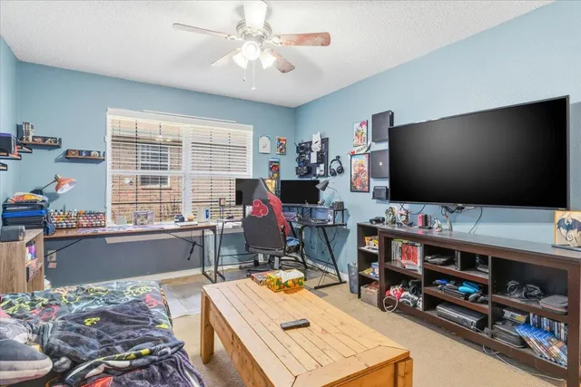 a room with furniture and a flat screen tv