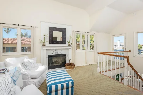 a bedroom with furniture and a fireplace