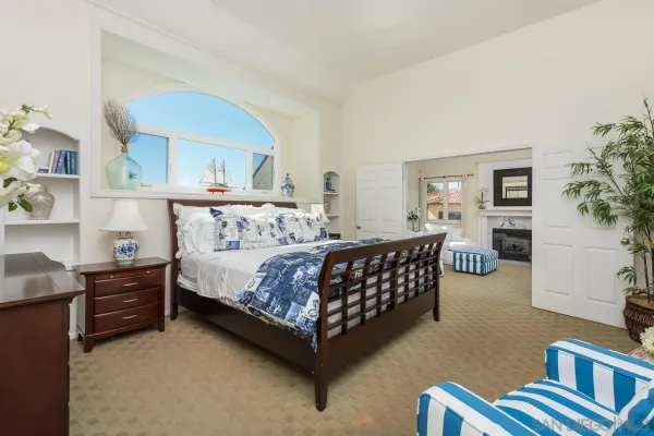 a bedroom with furniture and a window