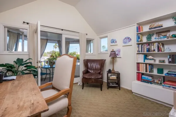 a workspace with furniture and a bookshelf