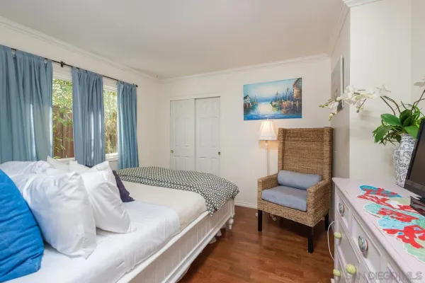 a bedroom with a bed and a couch