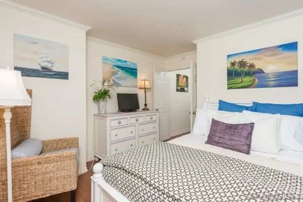 a bedroom with a bed and dresser