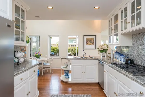 a kitchen with a sink and cabinets