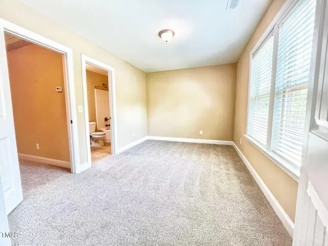 a kitchen with stainless steel appliances granite countertop a stove a refrigerator a sink a microwave a counter space and cabinets