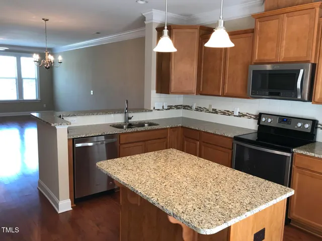 a kitchen with a table and chair