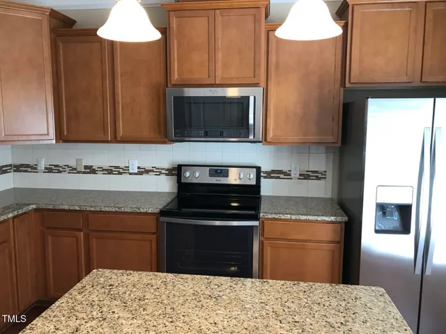 a view of dining room with wooden floor