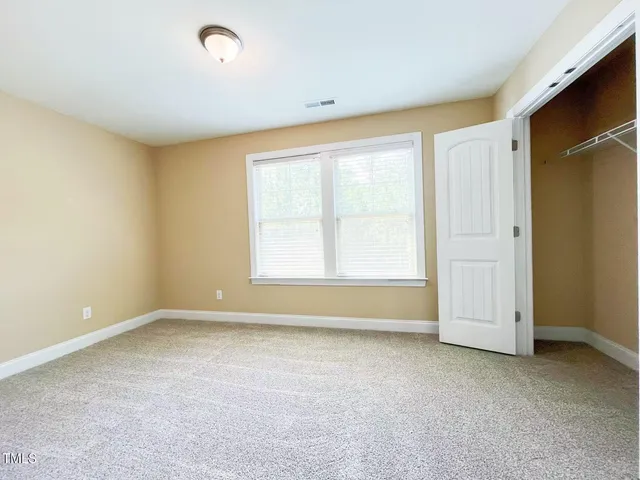 a view of a big room with carpet
