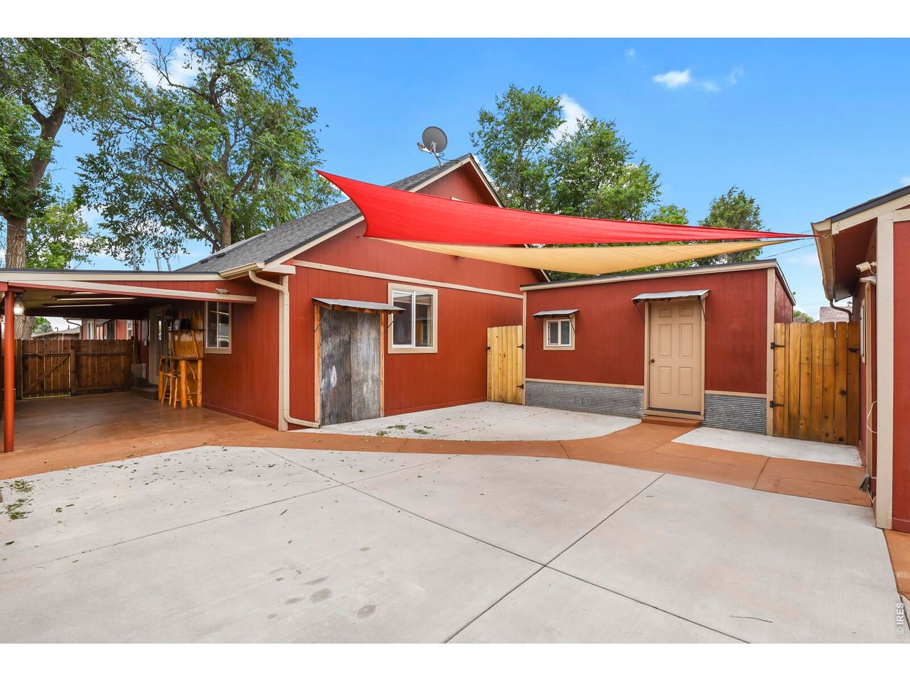 417 2nd Street Fort Lupton, CO 80621 - Photo 20 of 24 a front view of a house with a yard and garage