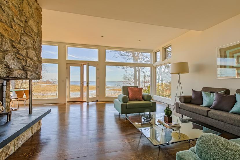 14 Outer Road South Norwalk, CT 06854 - Photo 1 of 38 a living room with furniture and a floor to ceiling window