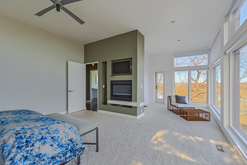 14 Outer Road South Norwalk, CT 06854 - Photo 18 of 38 a bedroom with a bed and glass door