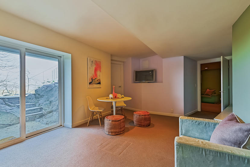 14 Outer Road South Norwalk, CT 06854 - Photo 23 of 38 a living room with furniture and a gate