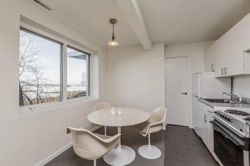 14 Outer Road South Norwalk, CT 06854 - Photo 25 of 38 a kitchen with a table and chairs in it