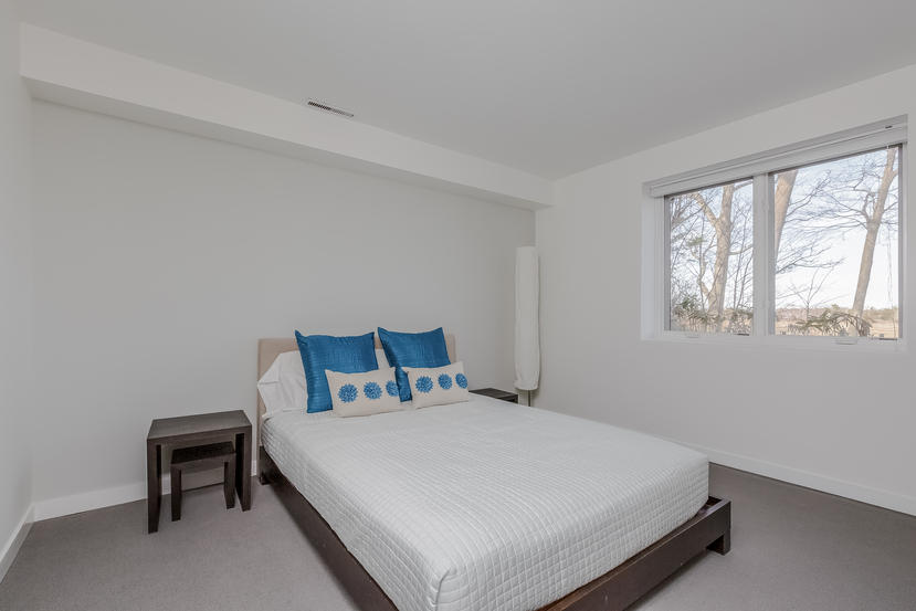 14 Outer Road South Norwalk, CT 06854 - Photo 27 of 38 a bedroom with a bed and a window