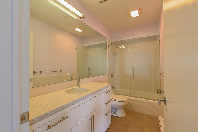 14 Outer Road South Norwalk, CT 06854 - Photo 28 of 38 a bathroom with a granite countertop sink a toilet and shower