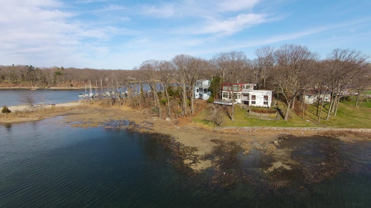 14 Outer Road South Norwalk, CT 06854 - Photo 32 of 38 a view of a lake with houses in the back