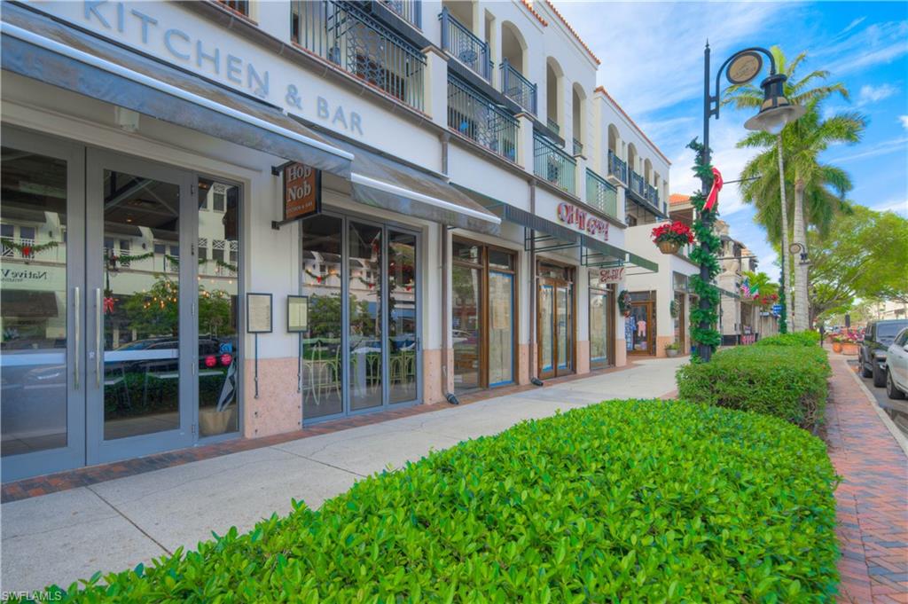 655 8th Avenue South, Unit 3 Naples, FL 34102 - Photo 43 of 48 front view of a building with a garden