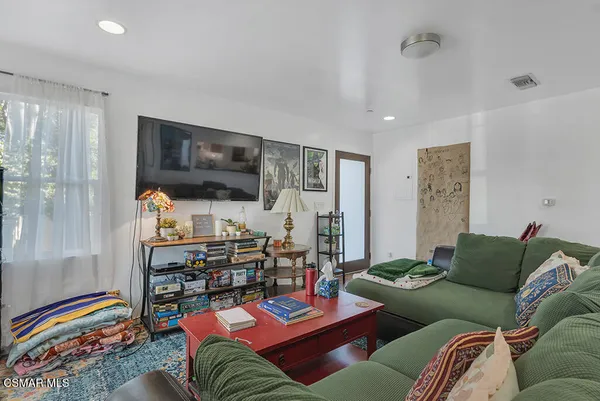 a living room with furniture and a table