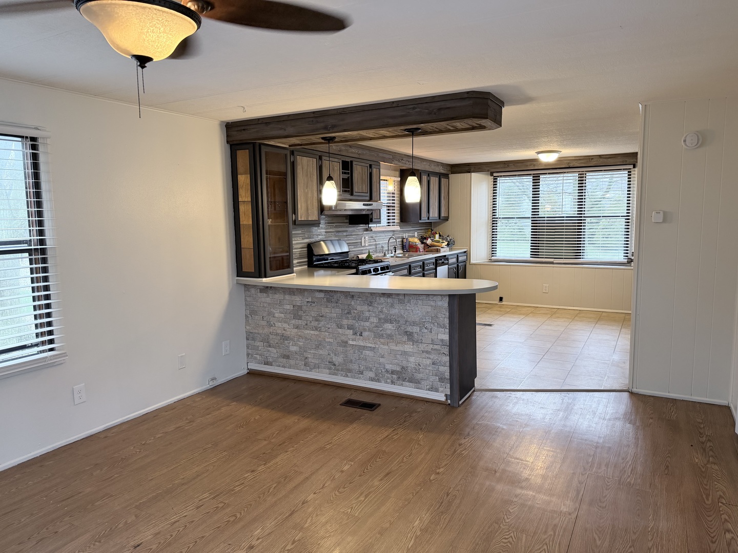 31 Meadowlark Lane Beecher, IL 60401 - Photo 11 of 22 a kitchen with stainless steel appliances granite countertop a stove and a wooden floors