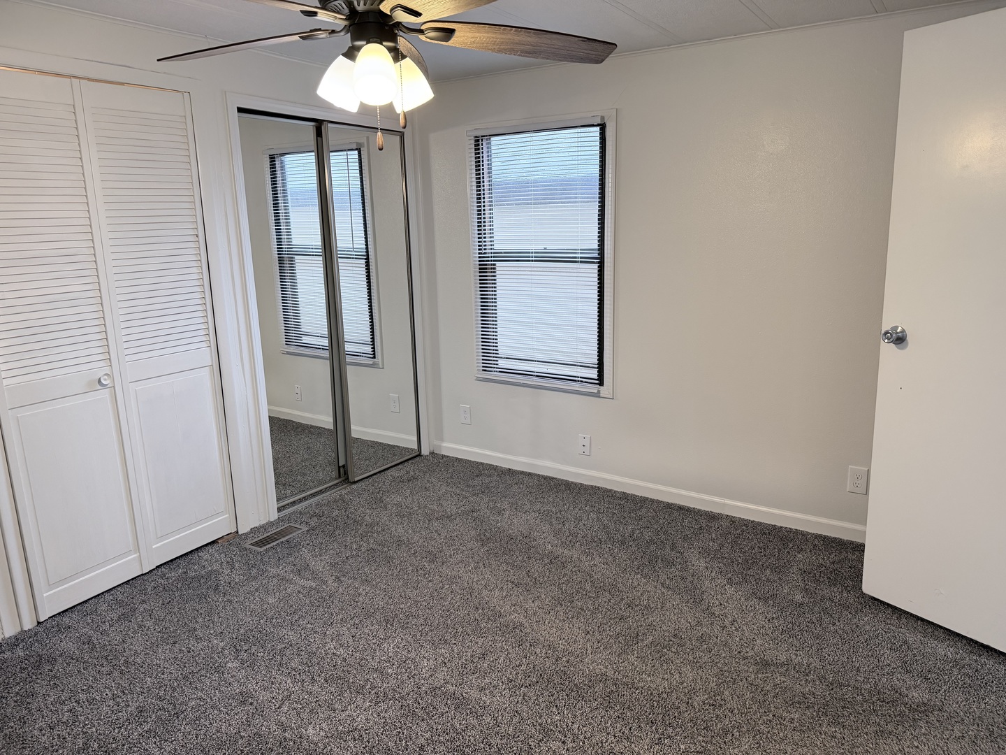 31 Meadowlark Lane Beecher, IL 60401 - Photo 17 of 22 an empty room with windows and chandelier fan