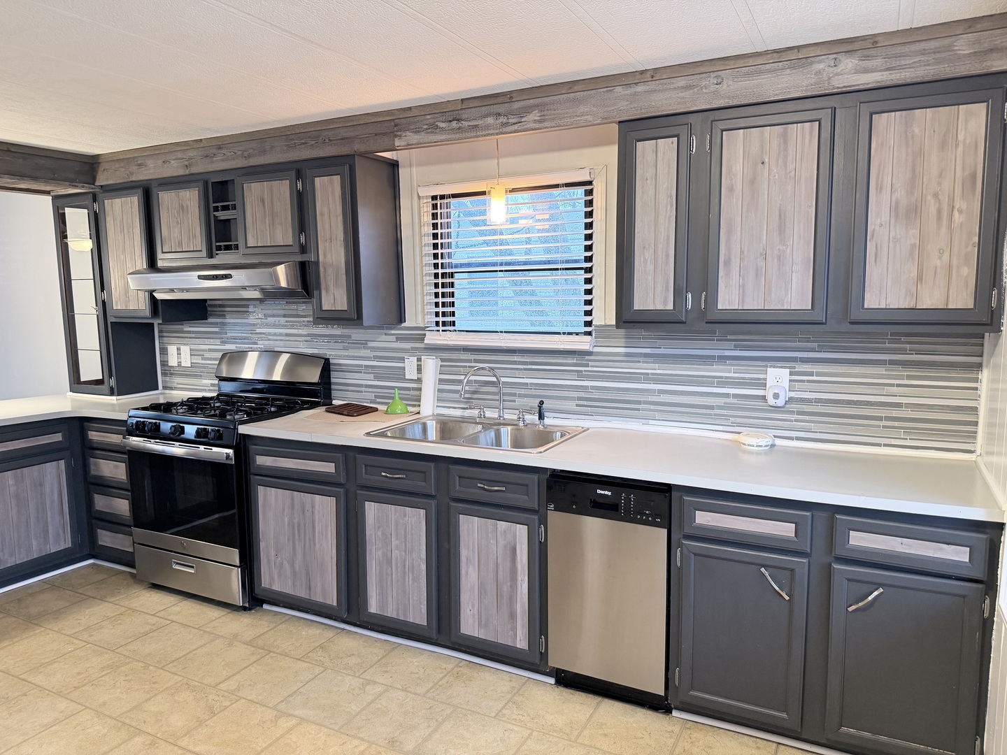 31 Meadowlark Lane Beecher, IL 60401 - Photo 7 of 22 a kitchen with stainless steel appliances granite countertop a sink stove and cabinets