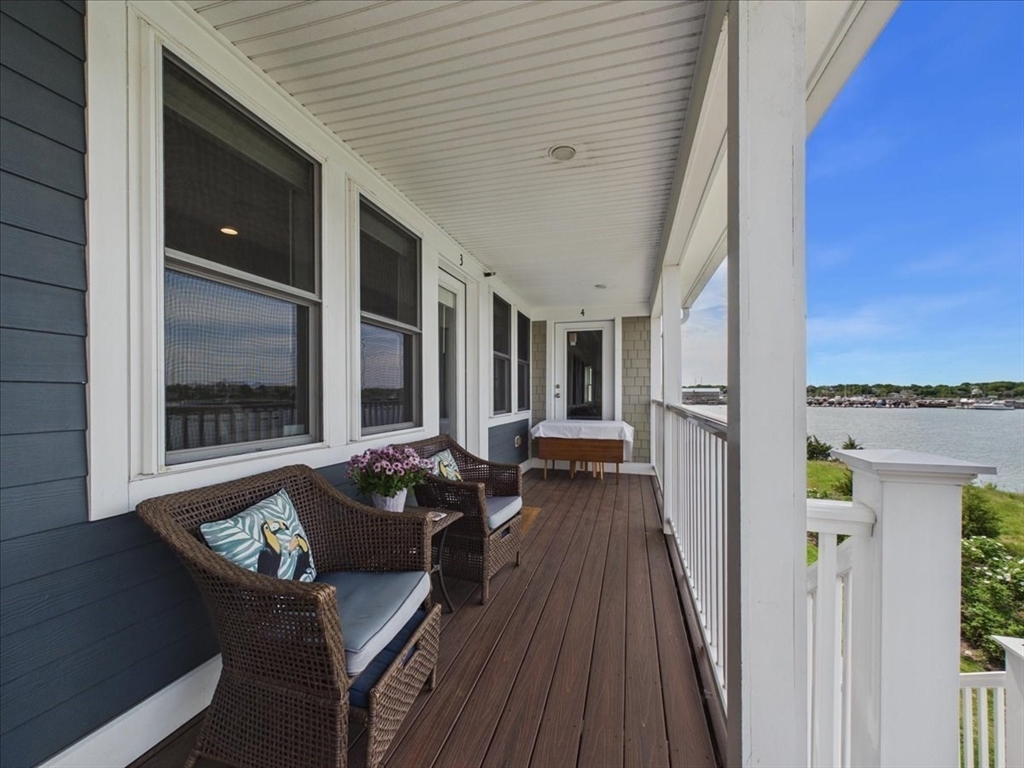 7 Bay Street, Unit 3 Hull, MA 02045 - Photo 9 of 40 a balcony with furniture and wooden floor