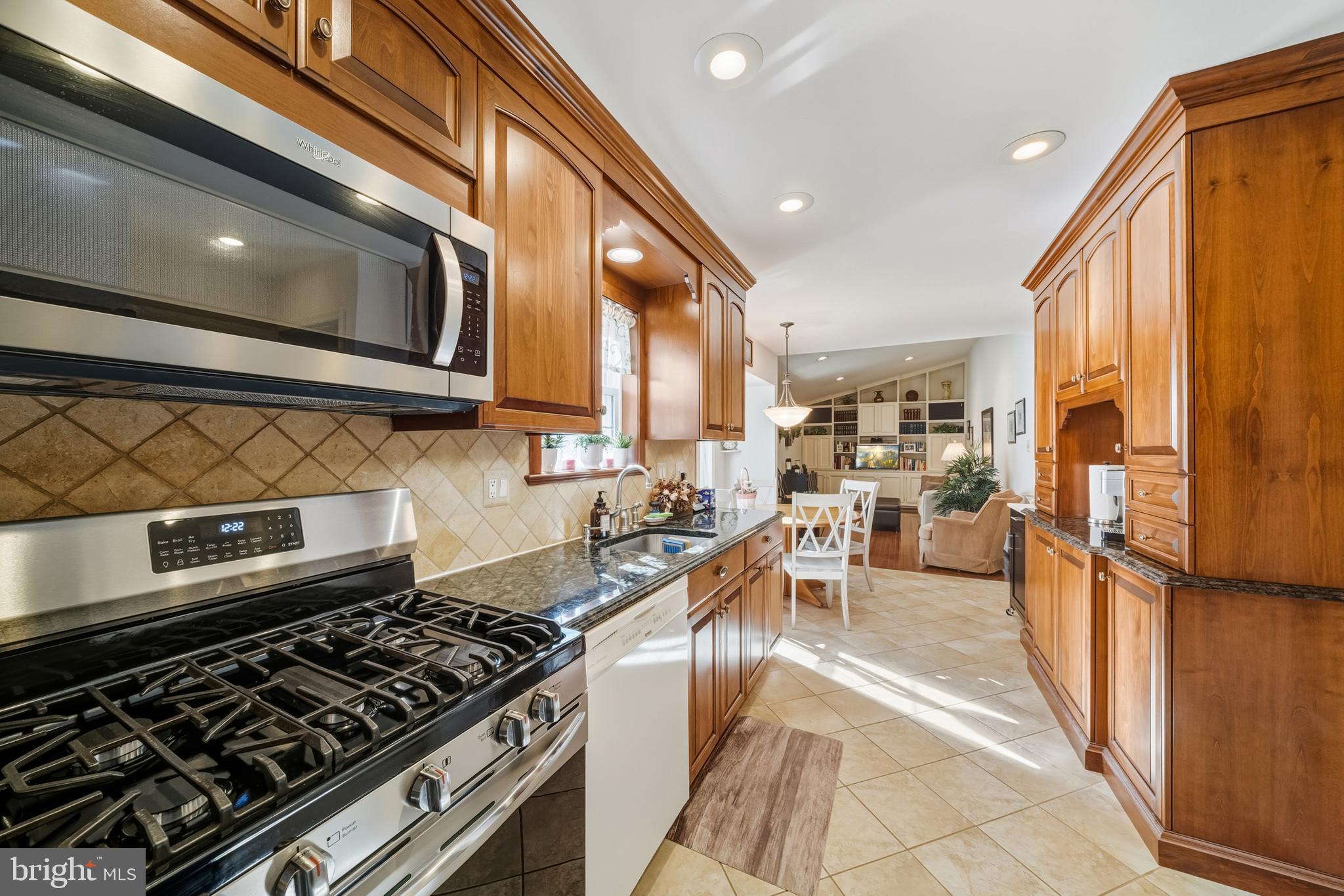 20 Allenhurst Court Gaithersburg, MD 20878 - Photo 20 of 57 a kitchen with stainless steel appliances granite countertop a stove a sink and a microwave
