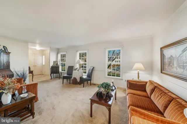 a bedroom with bed and dresser