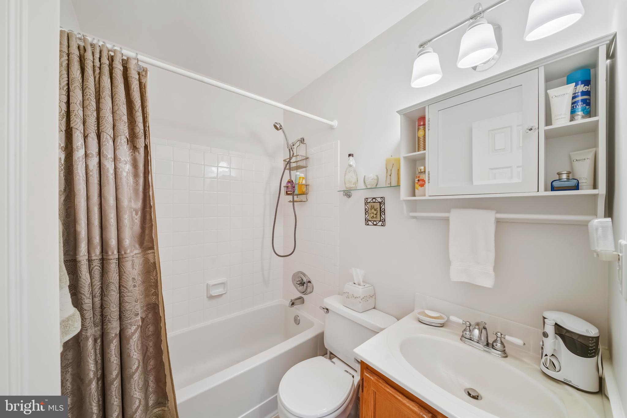 20 Allenhurst Court Gaithersburg, MD 20878 - Photo 45 of 57 a bathroom with a sink toilet and shower