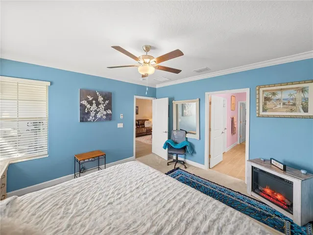 a bedroom with a bed dresser and a window