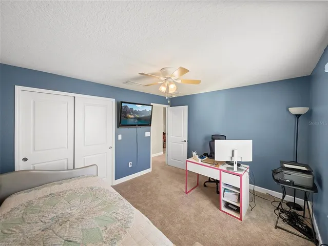 a bedroom with furniture and a window